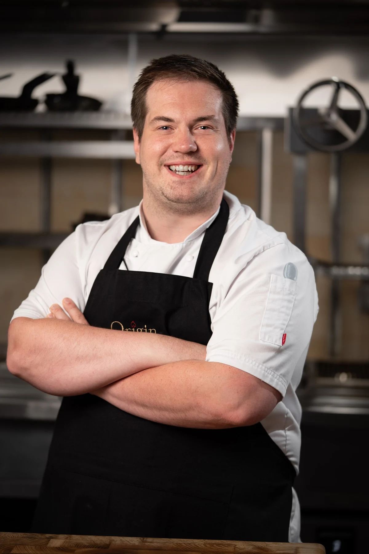 Same chef with relaxed shoulders and direct expression
