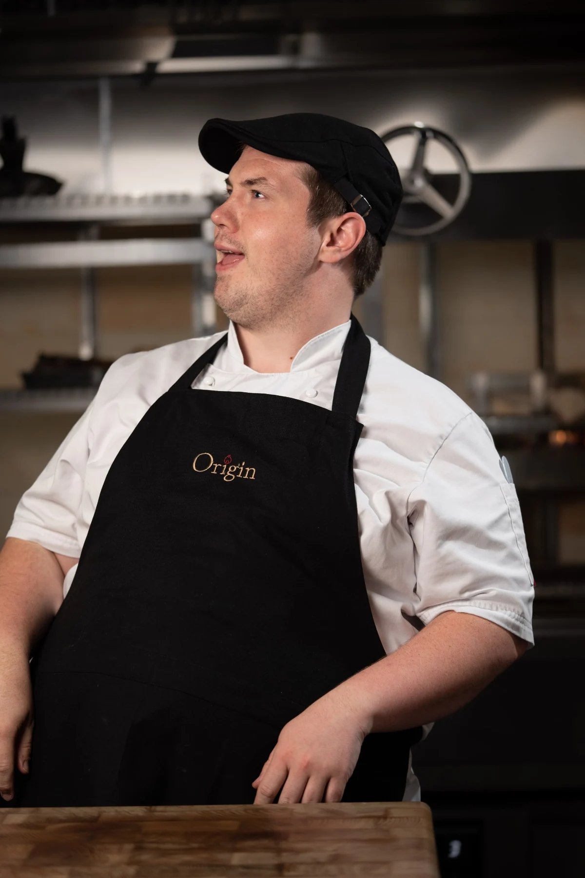 Same chef with a neutral side-facing expression