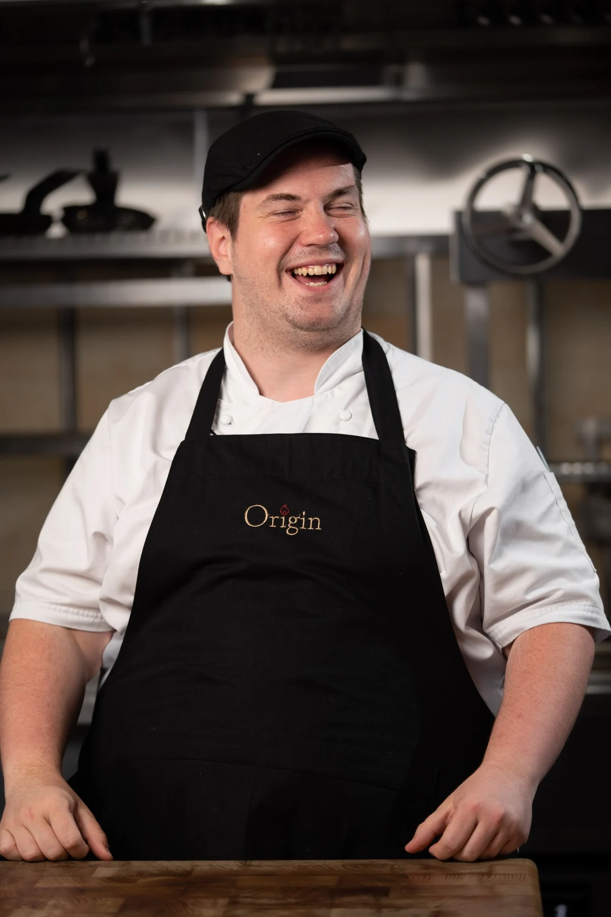 Same chef laughing naturally