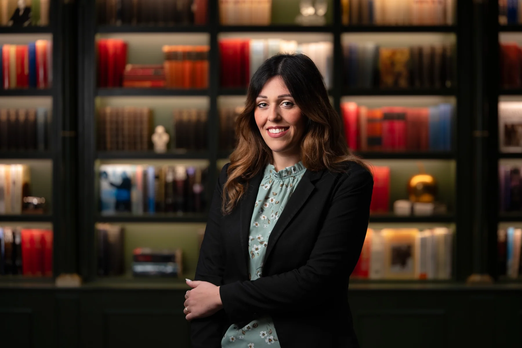Female member of a corporate team photographed in an elegant hotel library