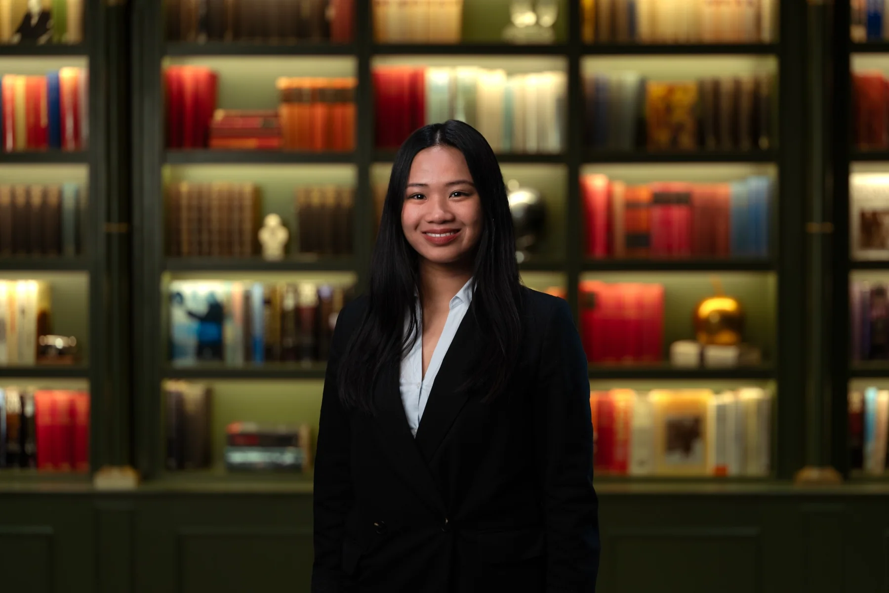 Female executive photographed against the same consistent backdrop